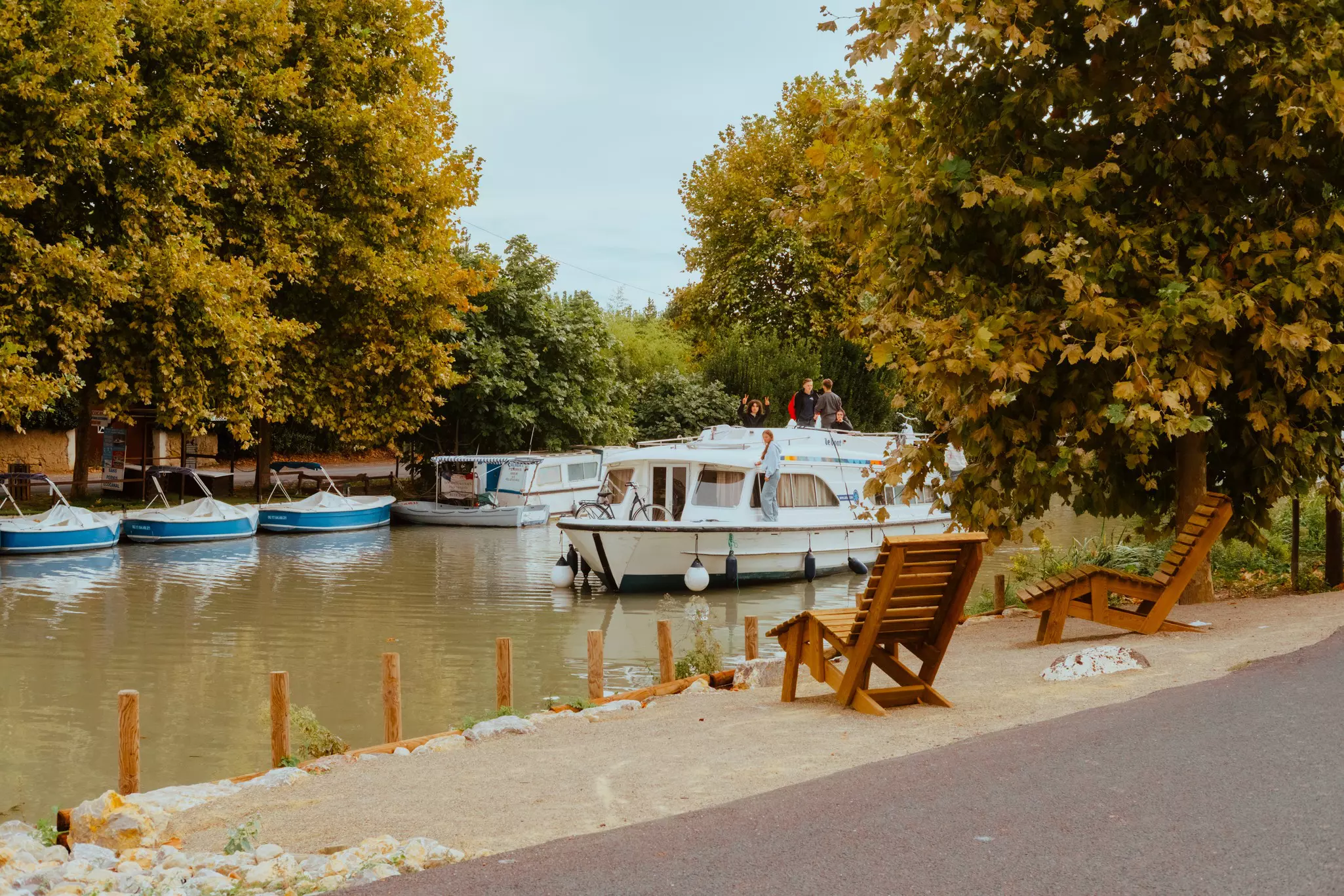 A boat floating in a canal.