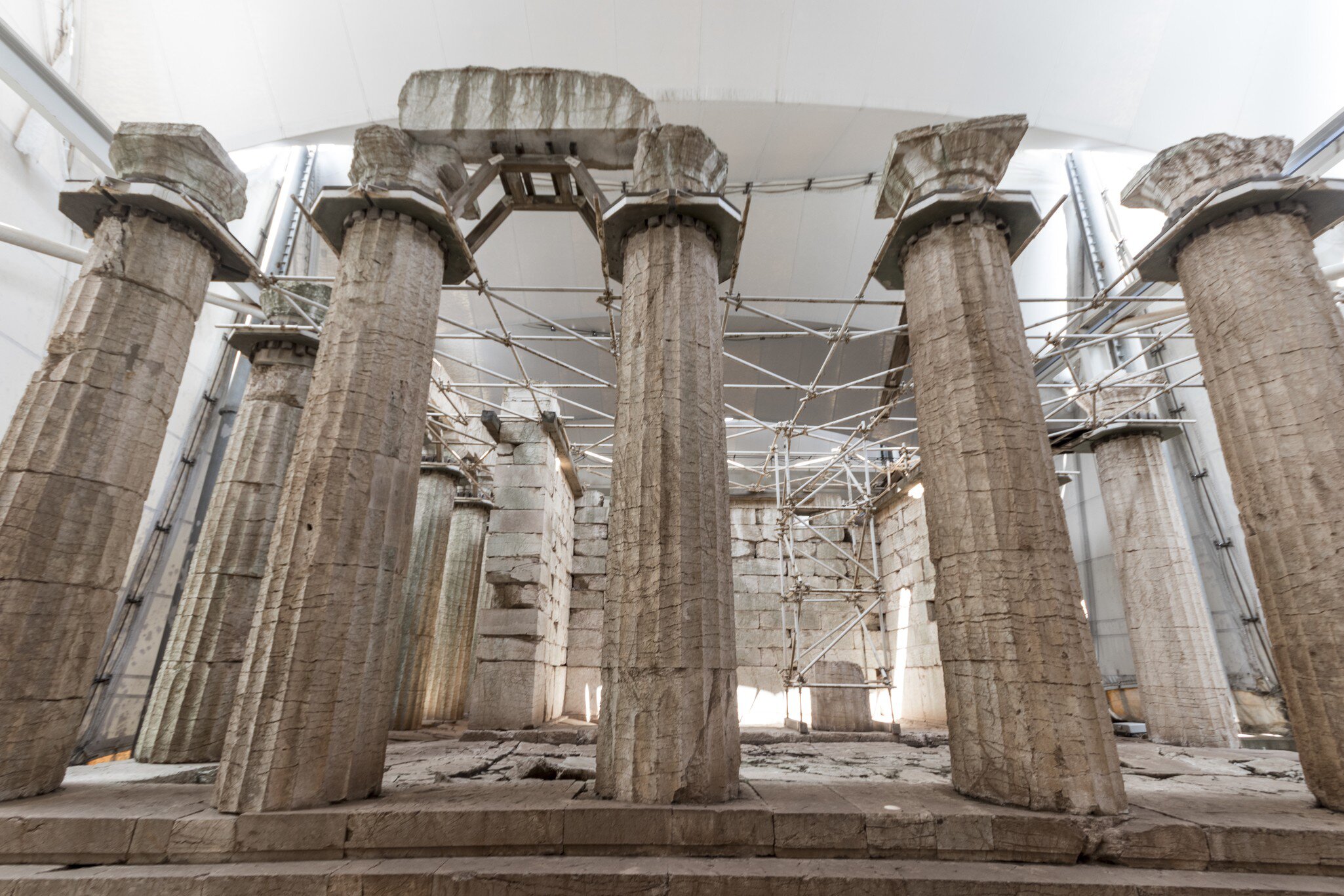 Bassae, Greece. Large ruined columns of the Temple of Apollo Epicurius inside a tent