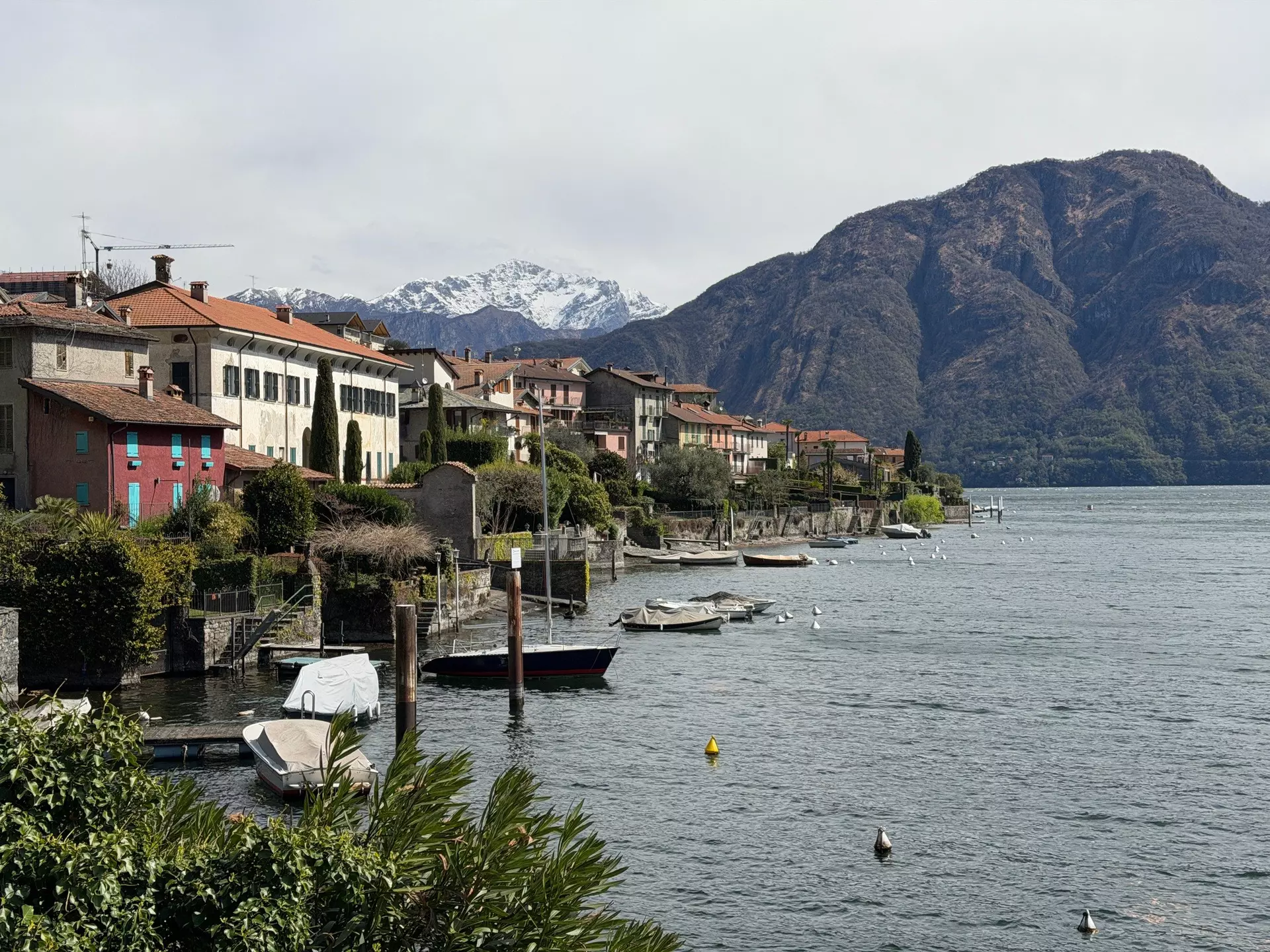 Woman swimming in Lake Como on a sunny day. 