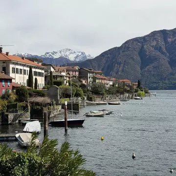 Woman swimming in Lake Como on a sunny day. 