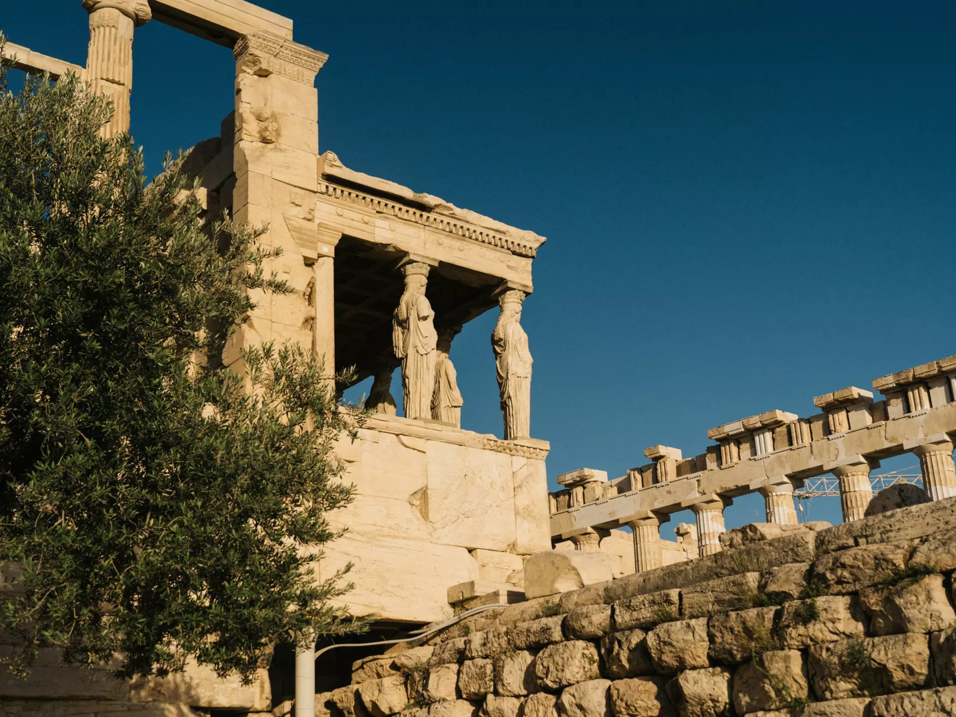An overcast blue sky above the Shrine of the Muses, Athens