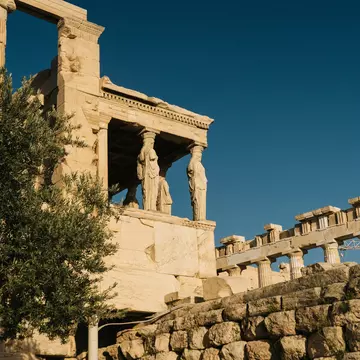 An overcast blue sky above the Shrine of the Muses, Athens