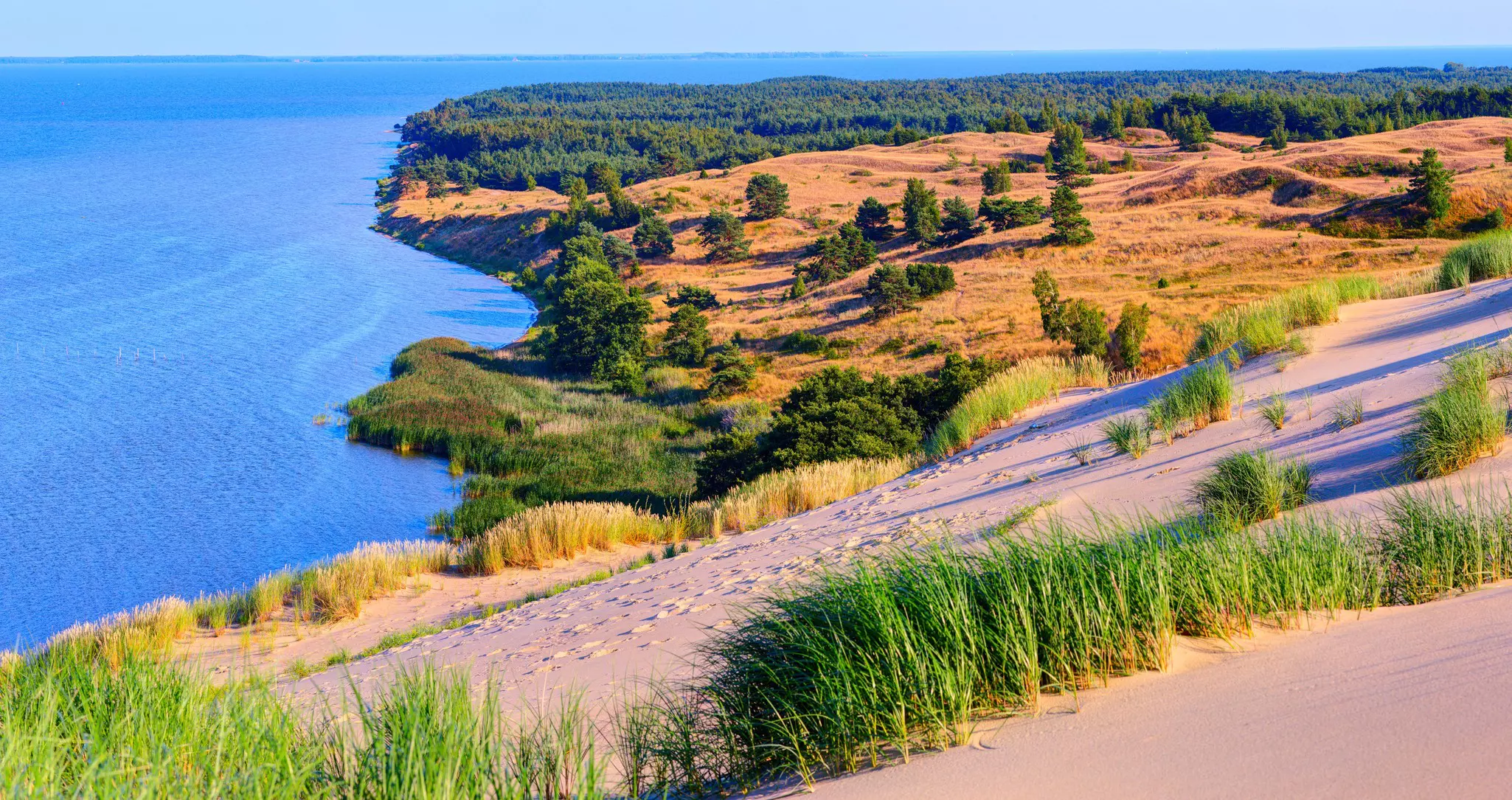 Sandy dunes during sunset at the Curonian Spit