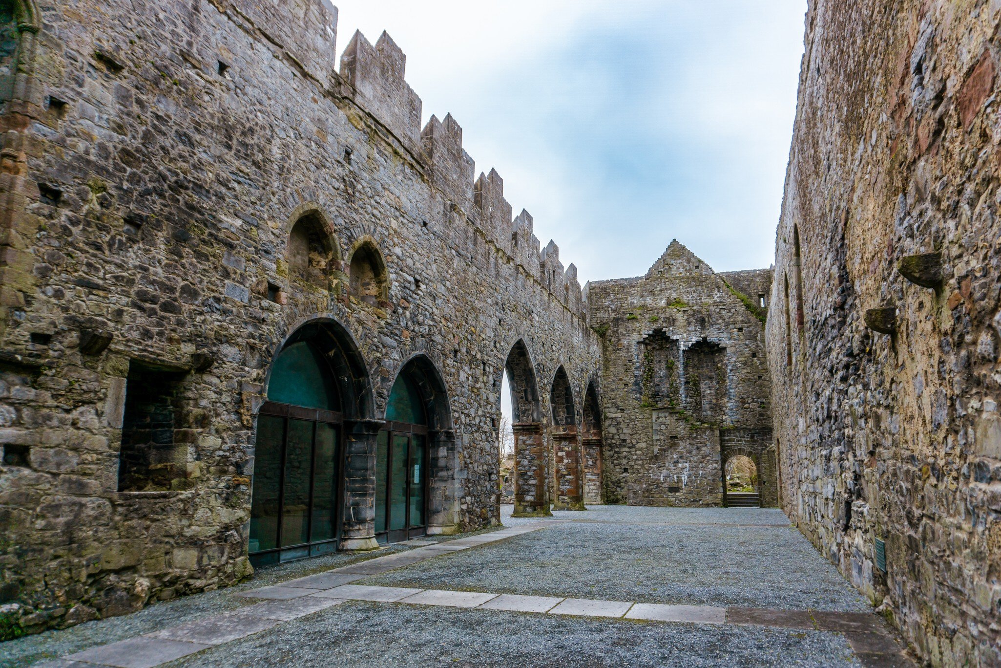 Wide-angle view of Ardfert friary cathedral ruins in County Kerry, Ireland.