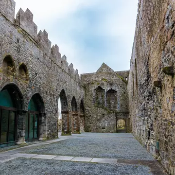 Wide-angle view of Ardfert friary cathedral ruins in County Kerry, Ireland.