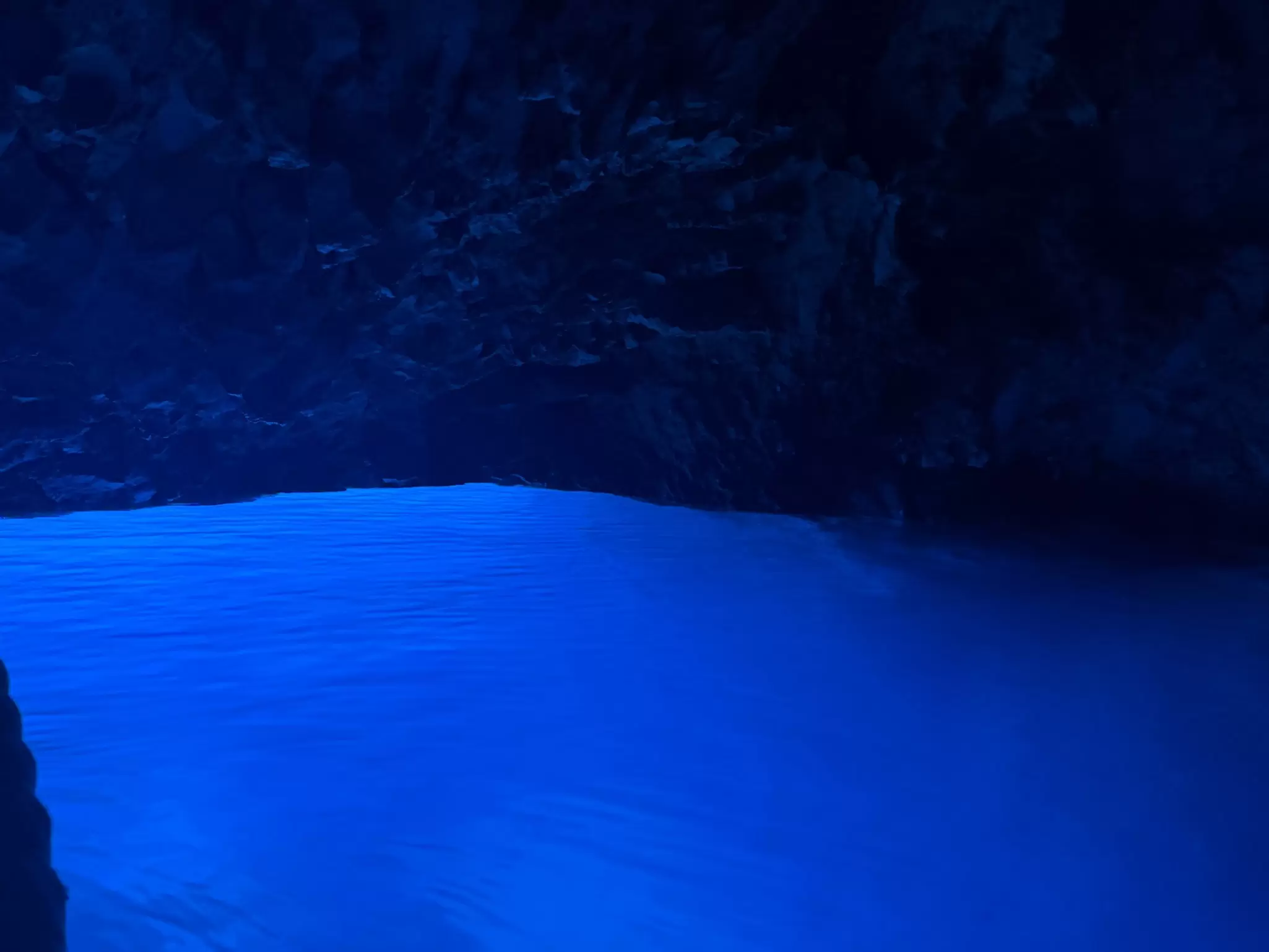 Vibrant blue water in a cave 