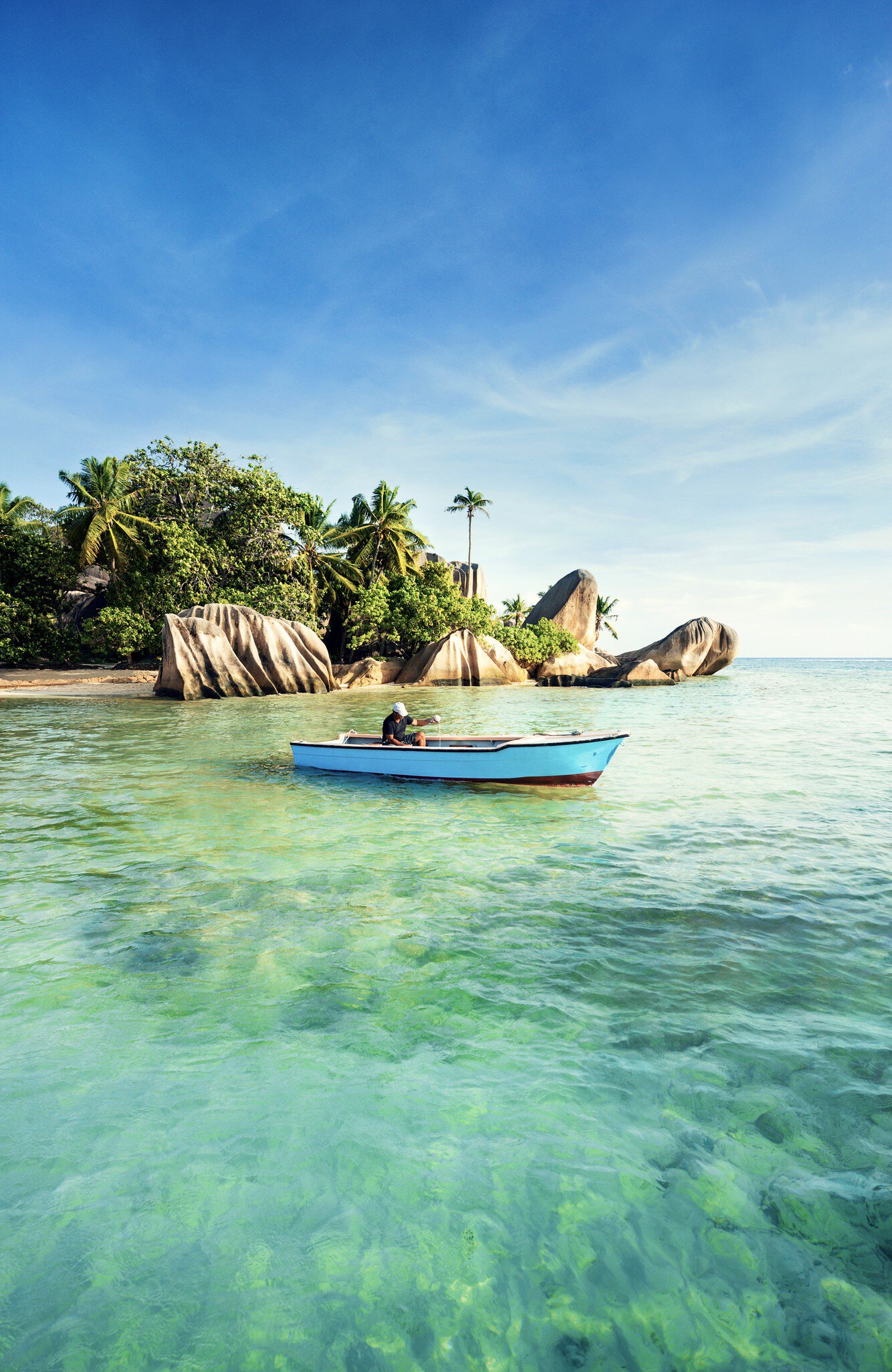Issue 53, Lonely Planet Traveller Magazine, The Seychelles, The perfect trip
Man fishing off Anse Source d’Argent beach.