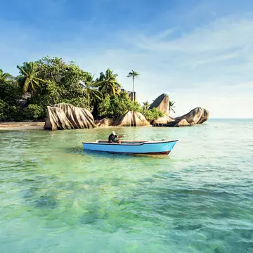 Issue 53, Lonely Planet Traveller Magazine, The Seychelles, The perfect trip
Man fishing off Anse Source d’Argent beach.