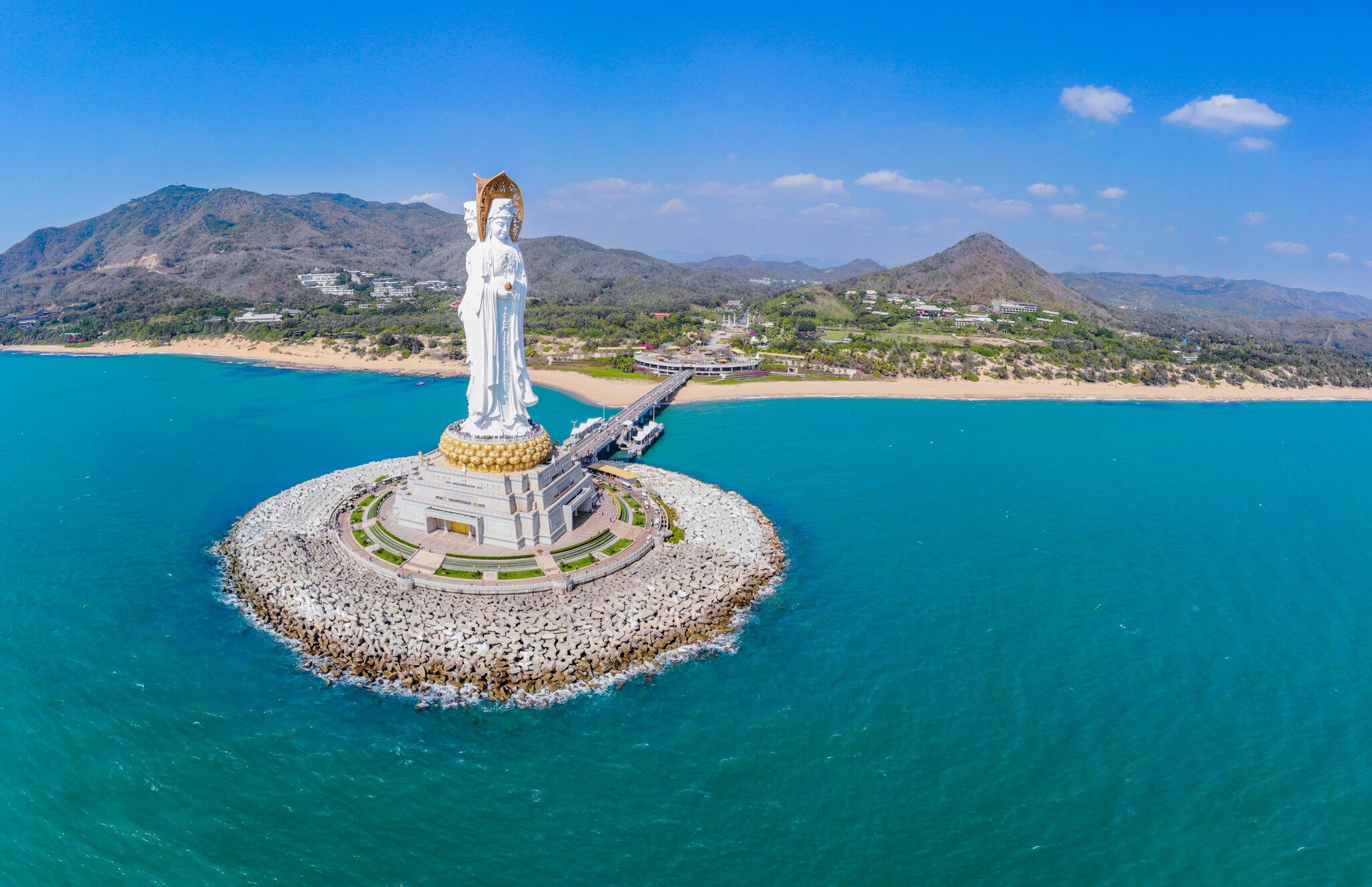 A huge white statue of a female figure beside the sea: Guanyin at Nanshan Temple, Sanya, Hainan, China