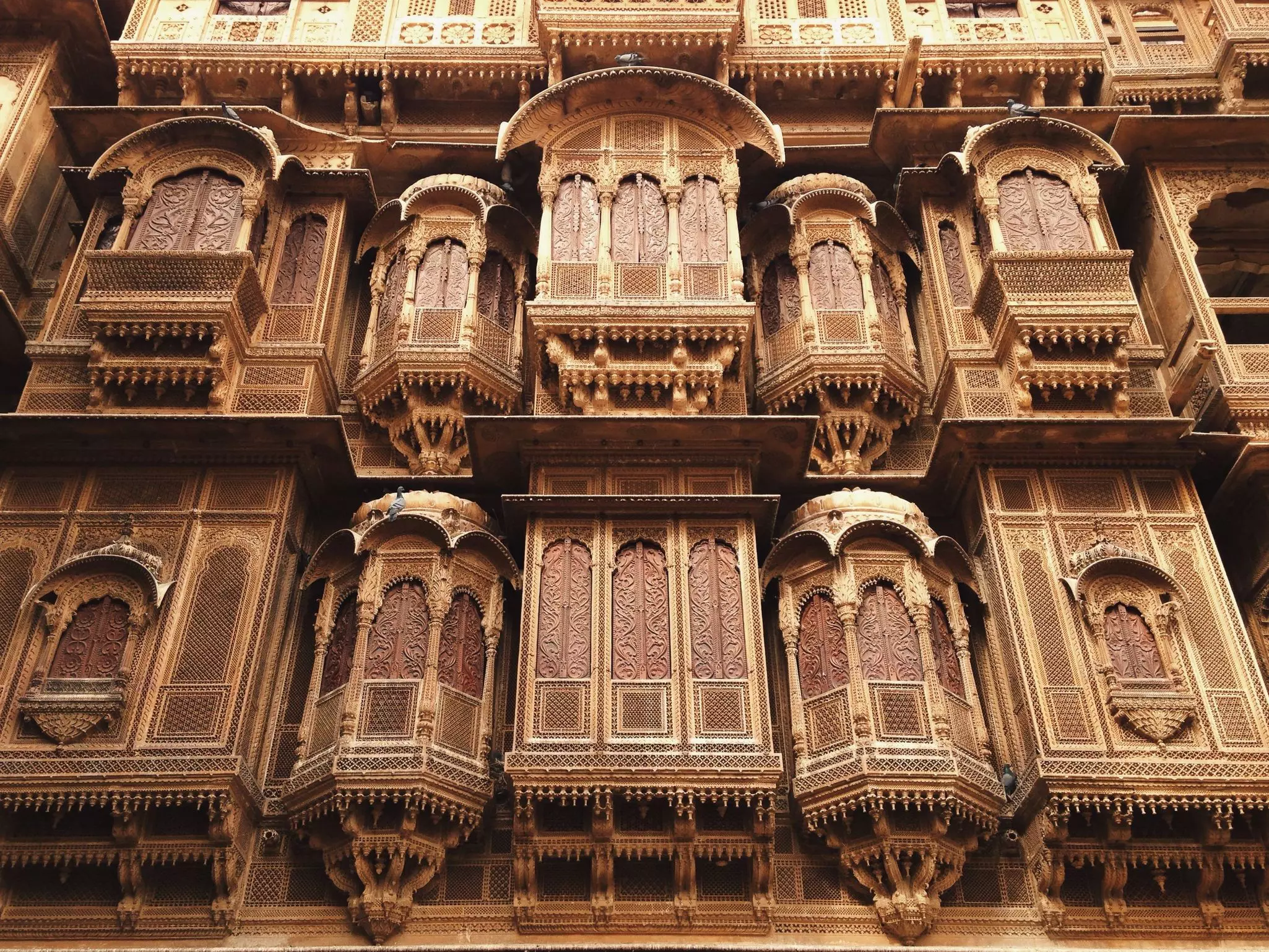 Intricately carved stone windows at the Patwa-ki-Haveli in Jaisalmer, Rajasthan, India.