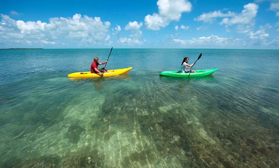 Man and a woman in kayaks at Key West.