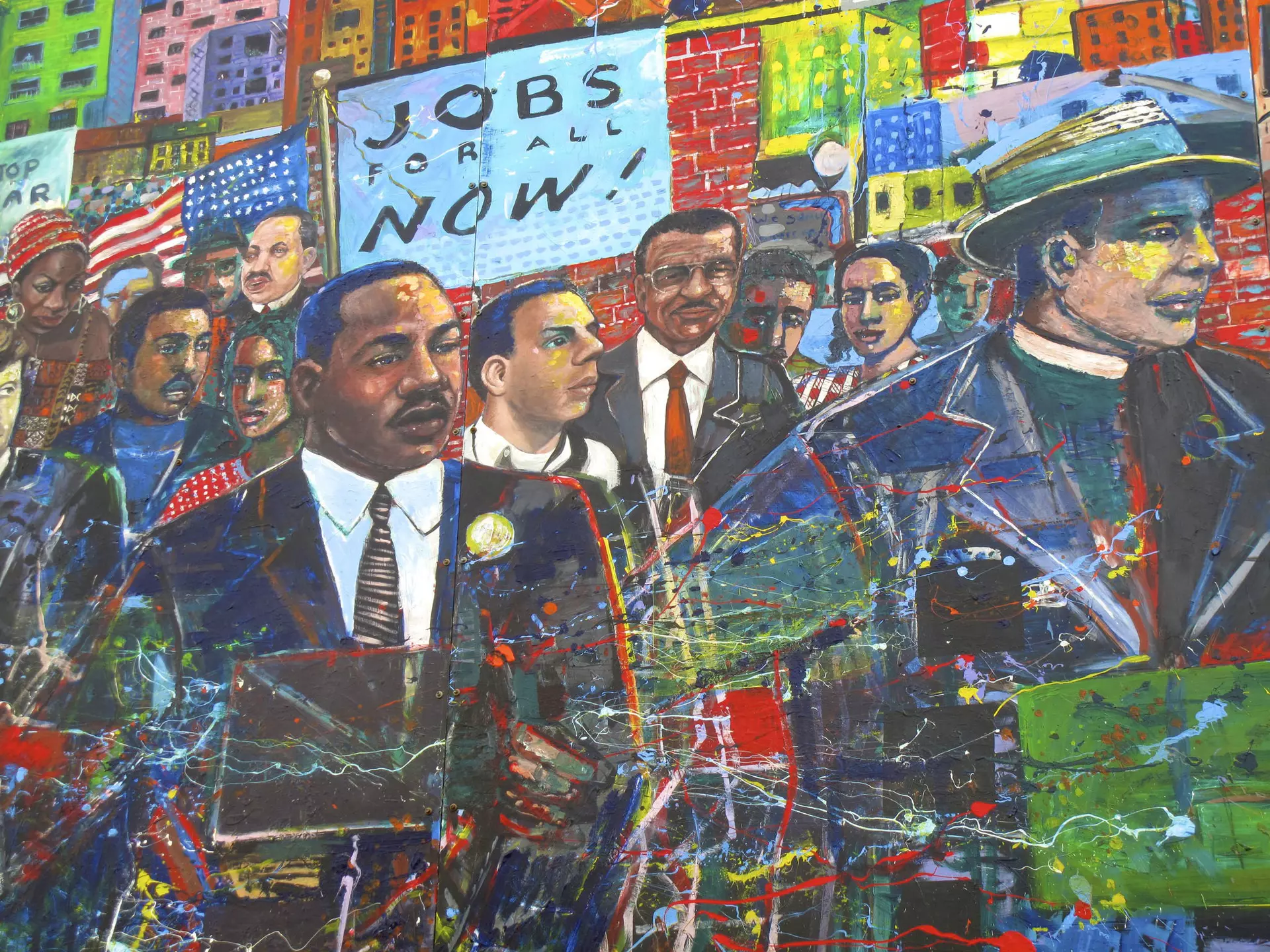 A painted mural depicts Martin Luther King Jr and other figures.