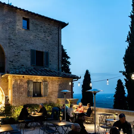 outdoor seating at a hotel restaurant overlooking a lake
