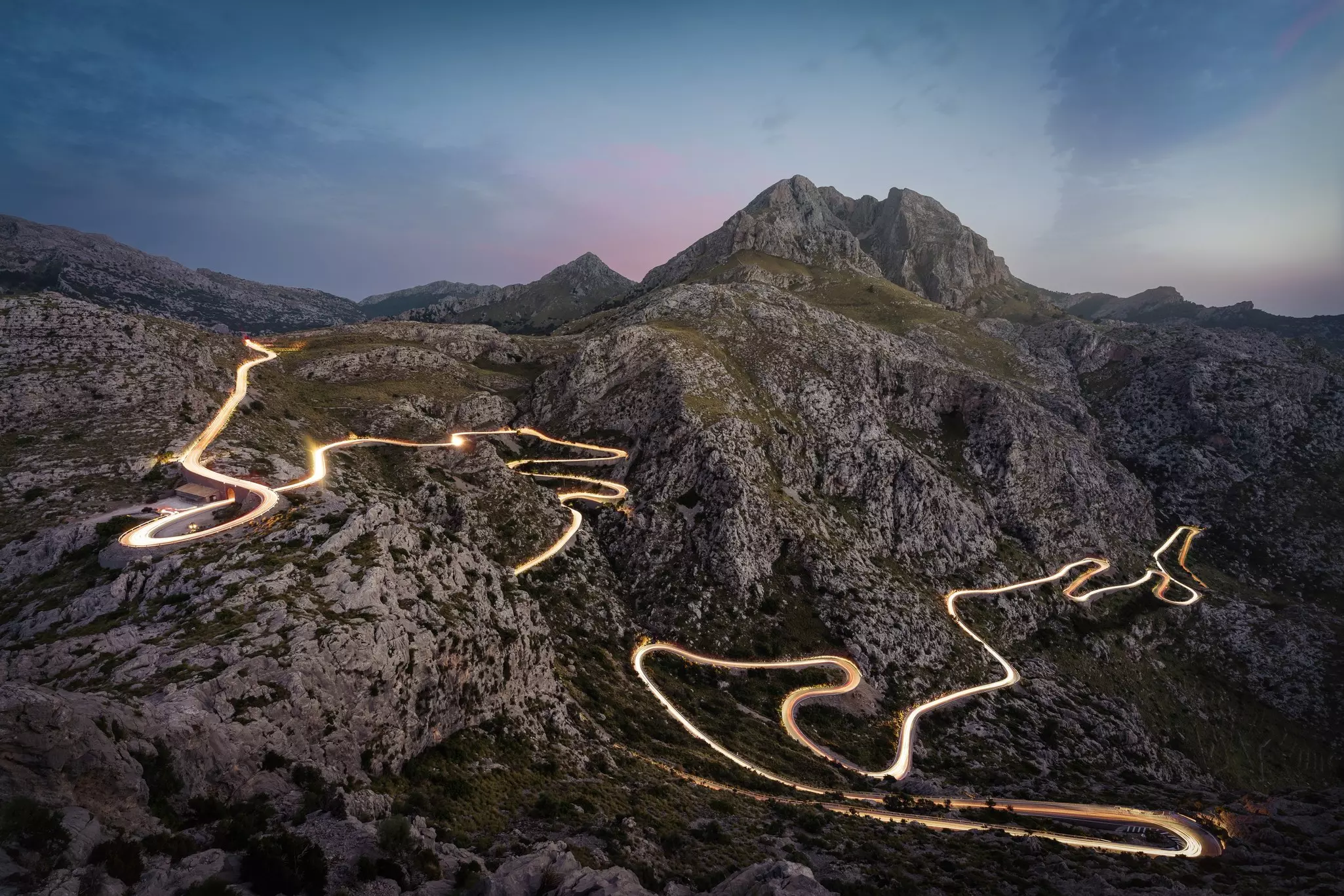 Mountain road with light trails