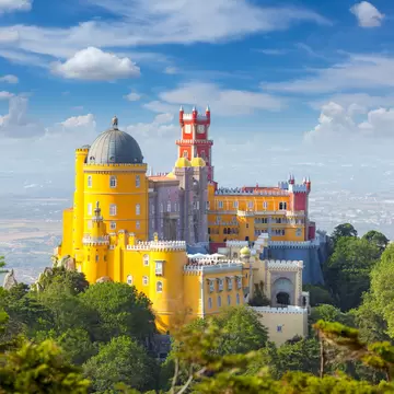 View over the Palácio Nacional da Pena on a sunny day in Sintra, Portugal.