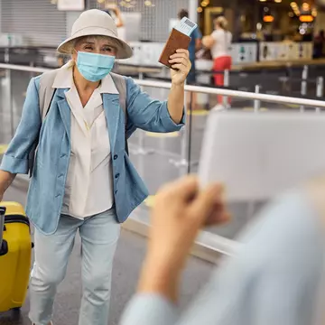 Woman wearing mask in airport.jpg