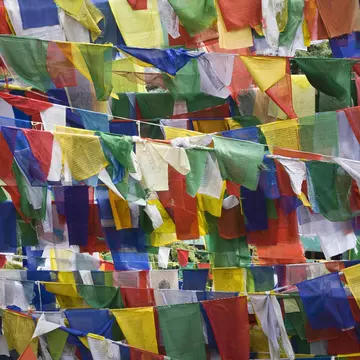 Tibetan Prayer Flags Fly On The Grounds Of The Tsuglagkhang Complex Which Is The Dalai Lamas Residence In Exile In McLeod Gang, Dharmsala, India