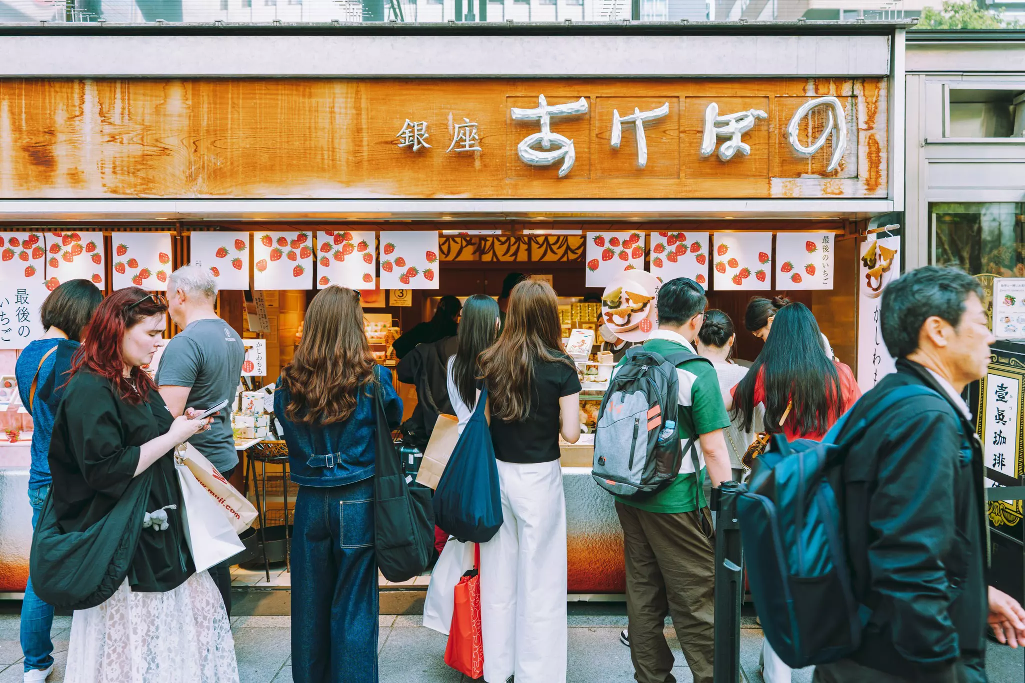 Tourists outside a Japanese sweet shop in Ginza, Tokyo. 