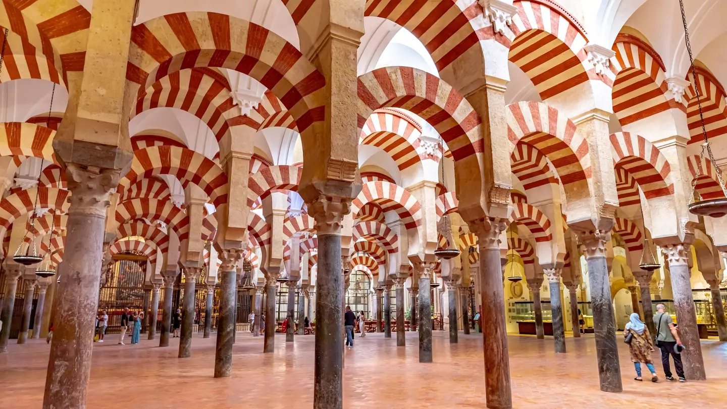 Red-and-white striped arches and columns.