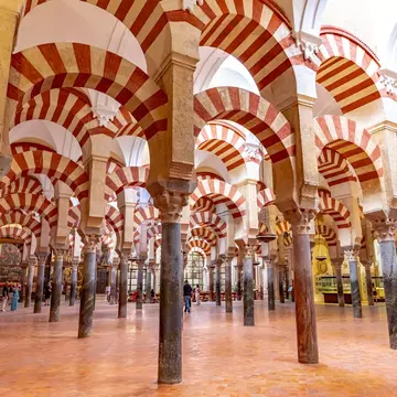 Red-and-white striped arches and columns.