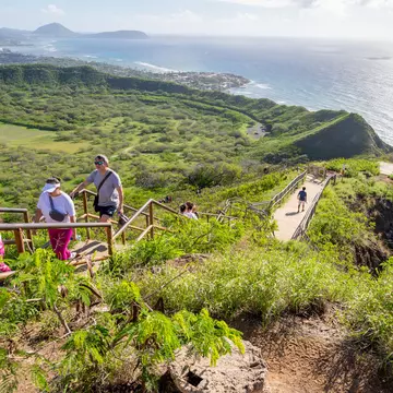 People walking up the trail to the top of Diamond Head. iStock