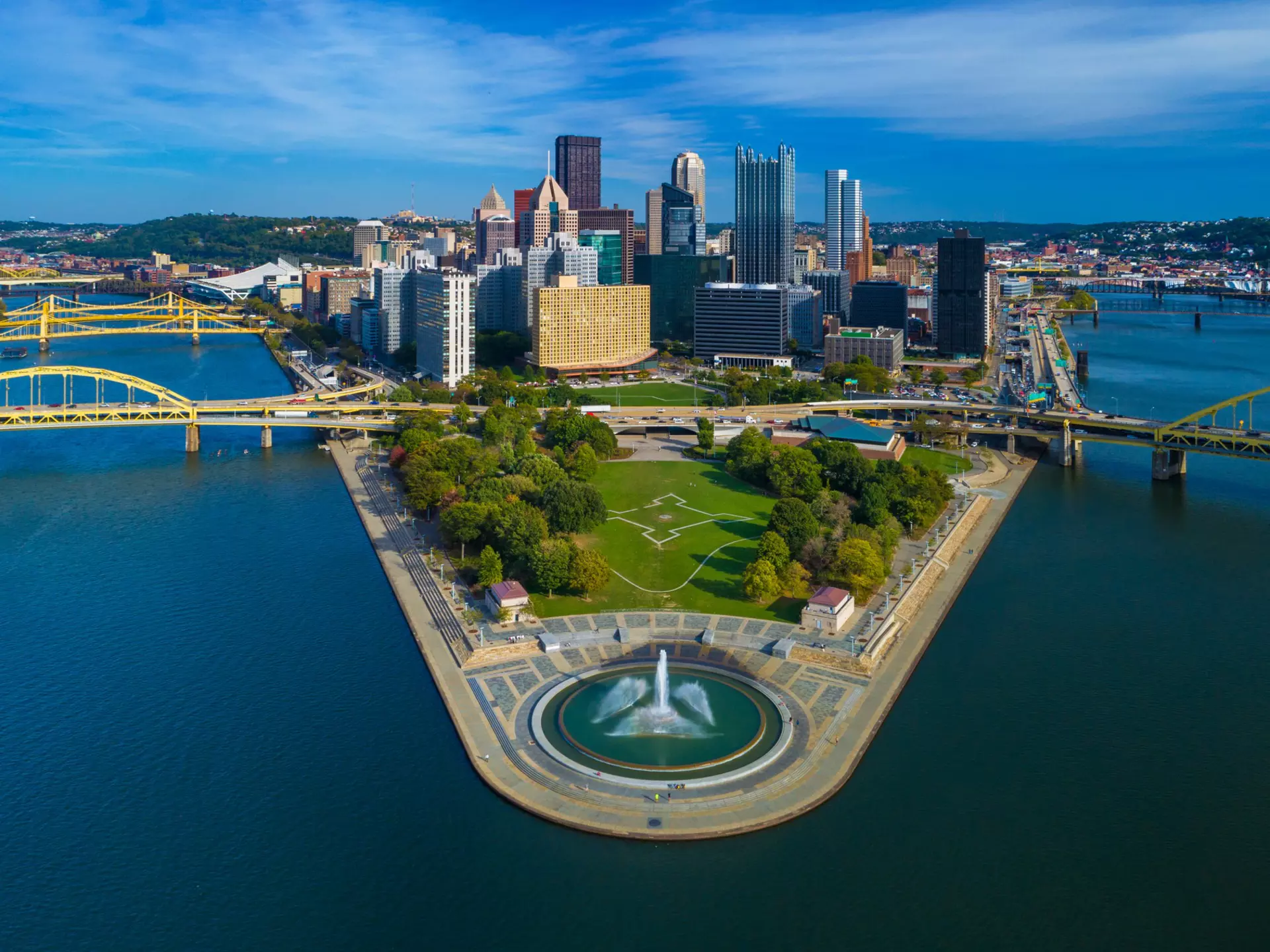 Downtown Pittsburgh skyline aerial view with Fort Duquesne (including a fountain), Point State Park, I-279, Allegheny River (left), Fort Duquesne Bridge (left), Monongahela River (right) and Fort Pitt Bridge (right) in the foreground.
1027467444