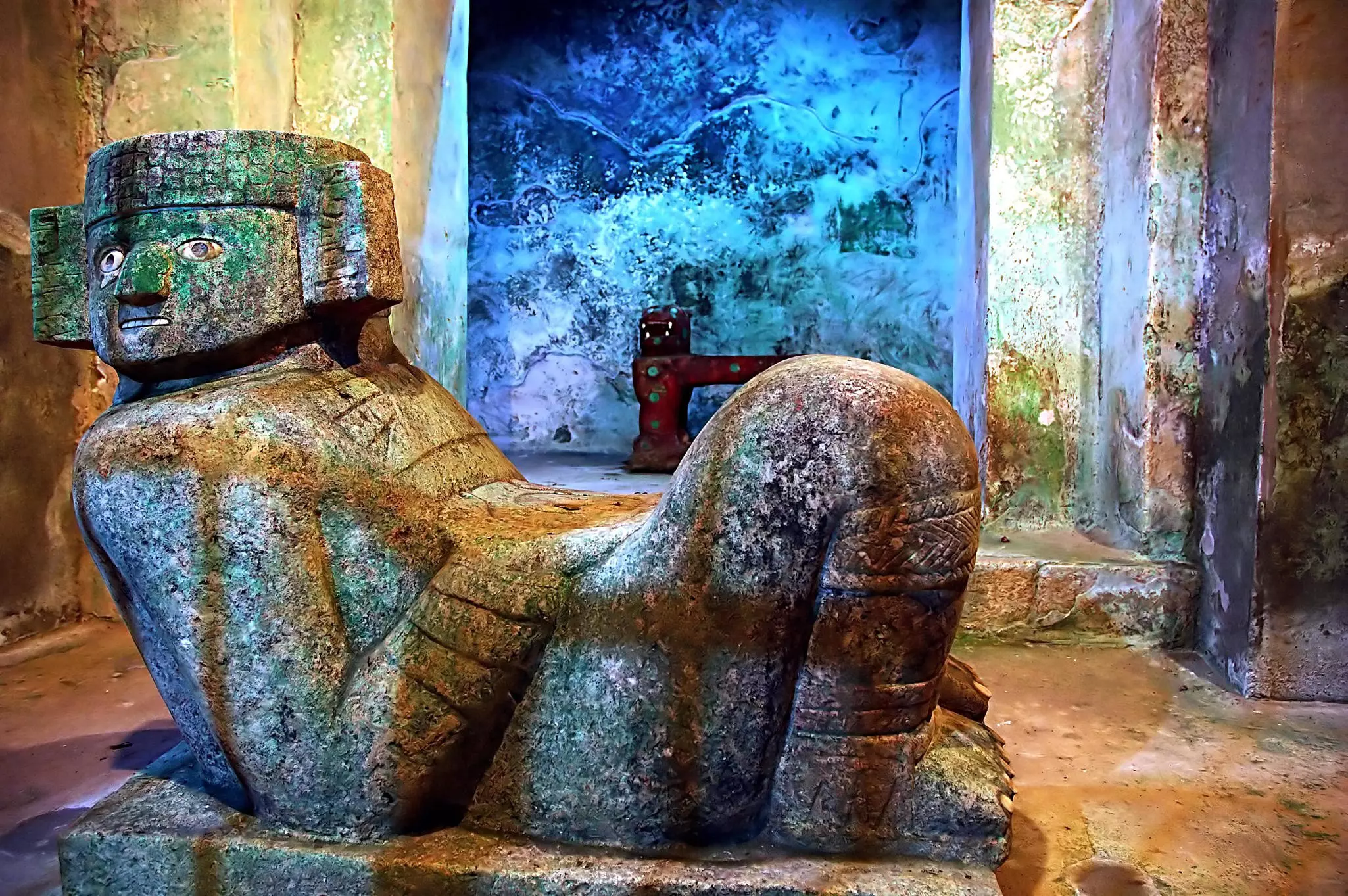 A large statue of a reclining Maya figure