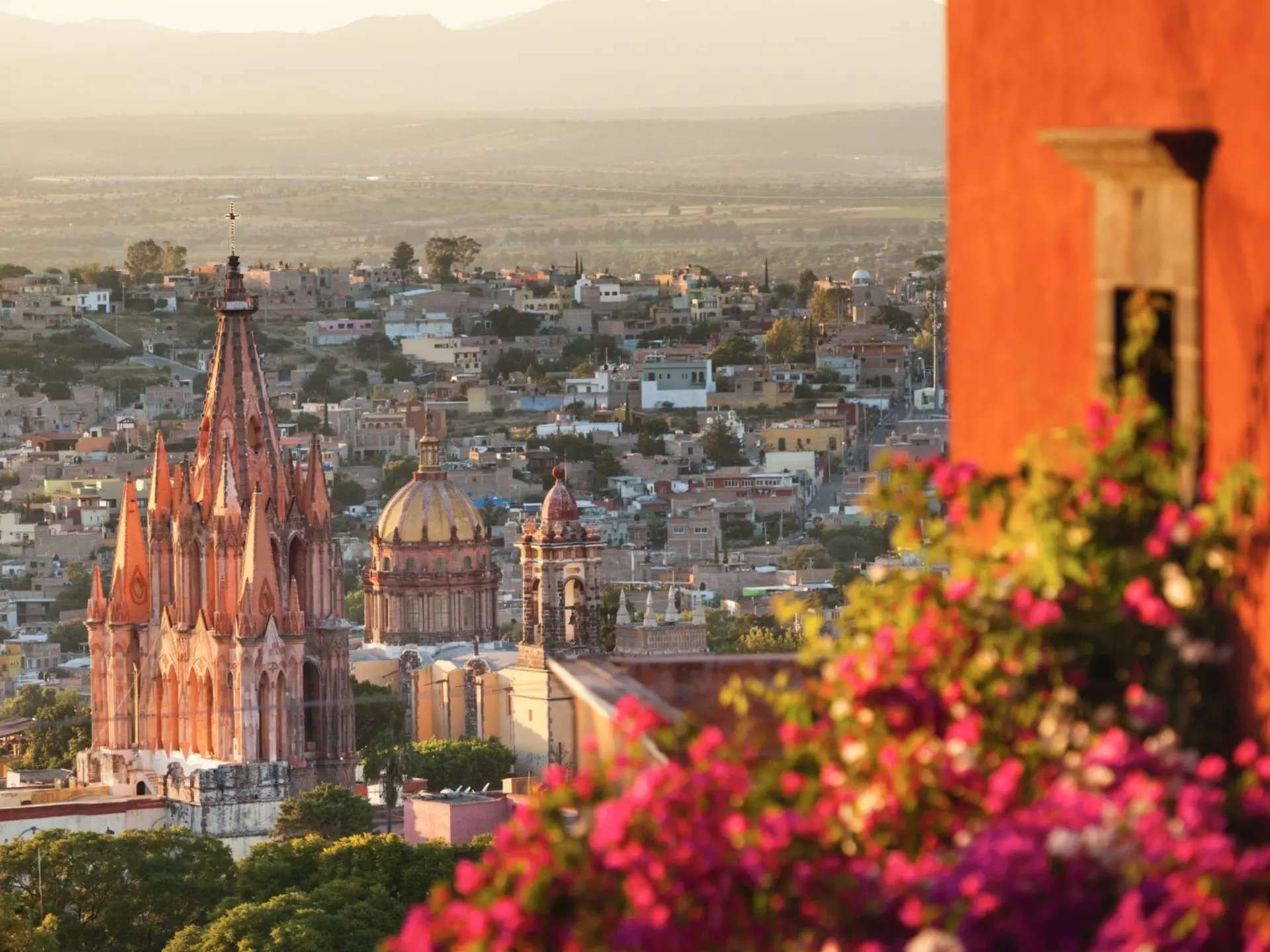 View of the Parroquia de San Miguel Arcángel from a balcony in San Miguel de Allende, Mexico.