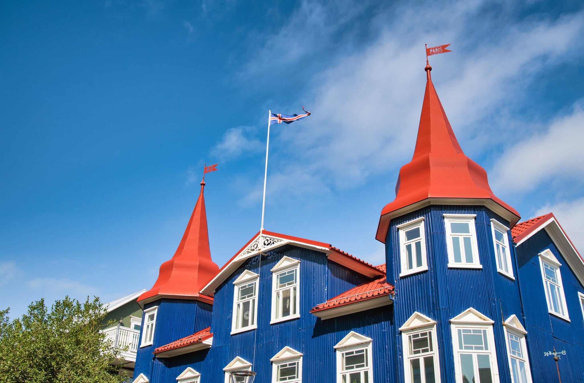 Blue building of Akureyri against beautiful summer sky, Iceland., License Type: media, Download Time: 2025-04-04T15:14:11.000Z, User: craig609286, Editorial: false, purchase_order: 65050 - Digital Destinations and Articles, job: Elsewhere, client: Elsewhere Itineraries, other: Craig Zapatka
