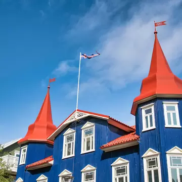 Blue building of Akureyri against beautiful summer sky, Iceland., License Type: media, Download Time: 2025-04-04T15:14:11.000Z, User: craig609286, Editorial: false, purchase_order: 65050 - Digital Destinations and Articles, job: Elsewhere, client: Elsewhere Itineraries, other: Craig Zapatka