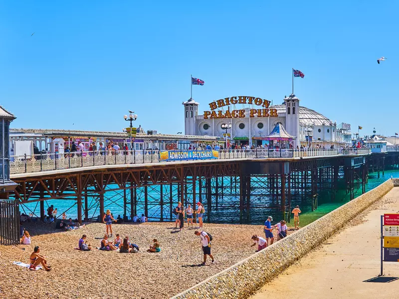 Brighton seafront and pier and beach activities, with crowds in sweltering record temperatures                         
