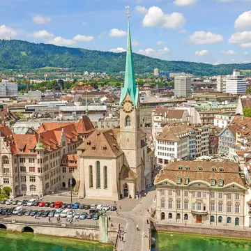 Aerial view of historic Zurich city center with famous Fraumunster Church and river Limmat at Lake Zurich from Grossmunster Church on a sunny day with clouds in summer, Canton of Zurich, Switzerland  License Type: media  Download Time: 2021-04-07T11:19:27.000Z  User: aniabartoszek  Is Editorial: No  purchase_order:   