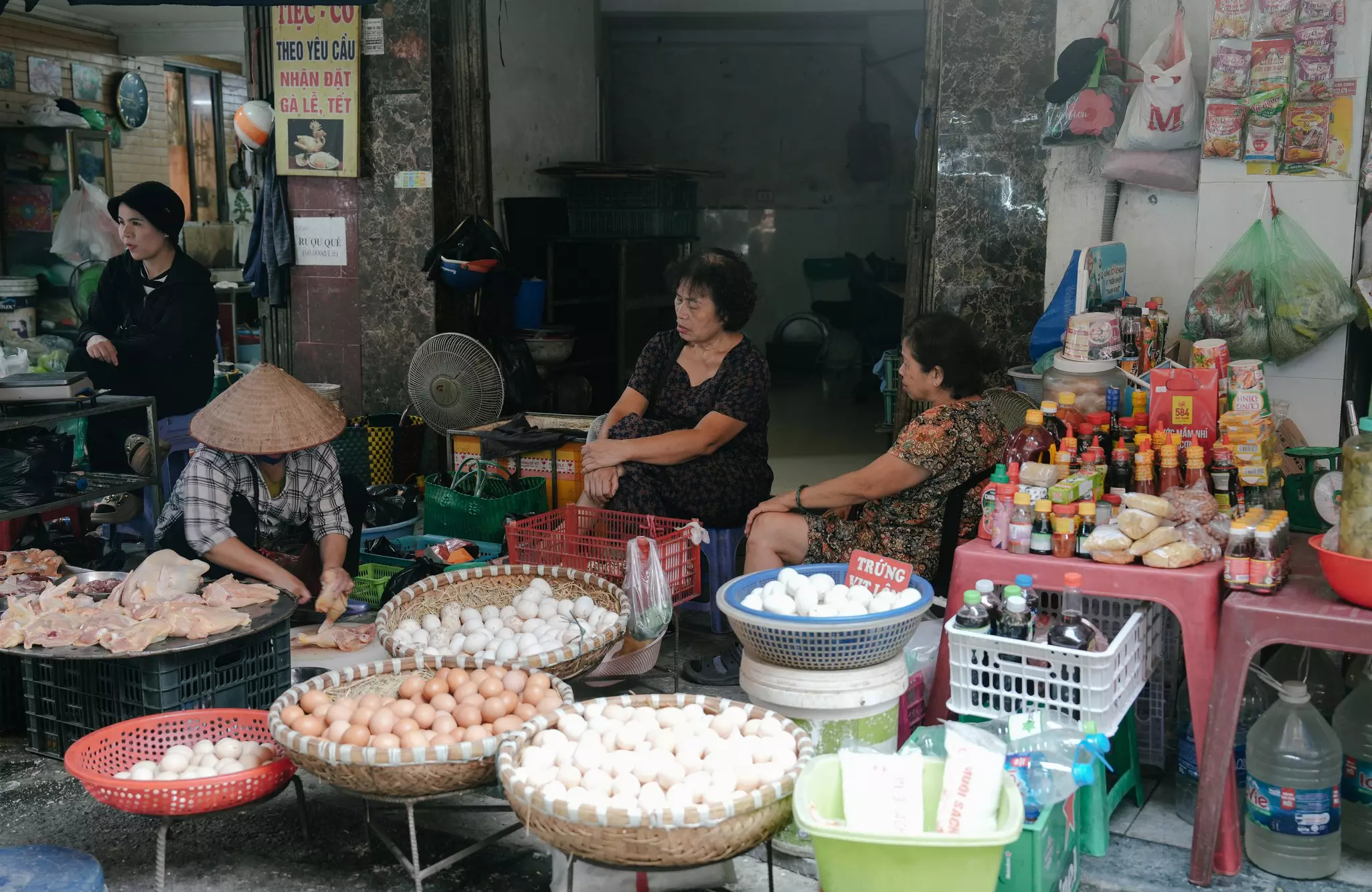 Street vendors in Hanoi selling eggs, sauces and other items