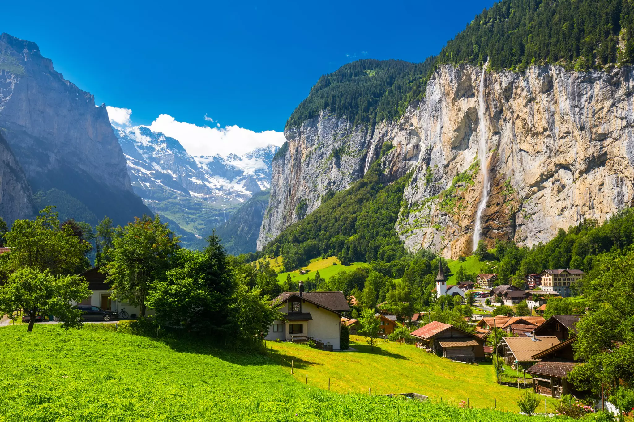 Waterfalls in the Lauterbrunnen Valley with the Swiss Alps in the background, Switzerland.