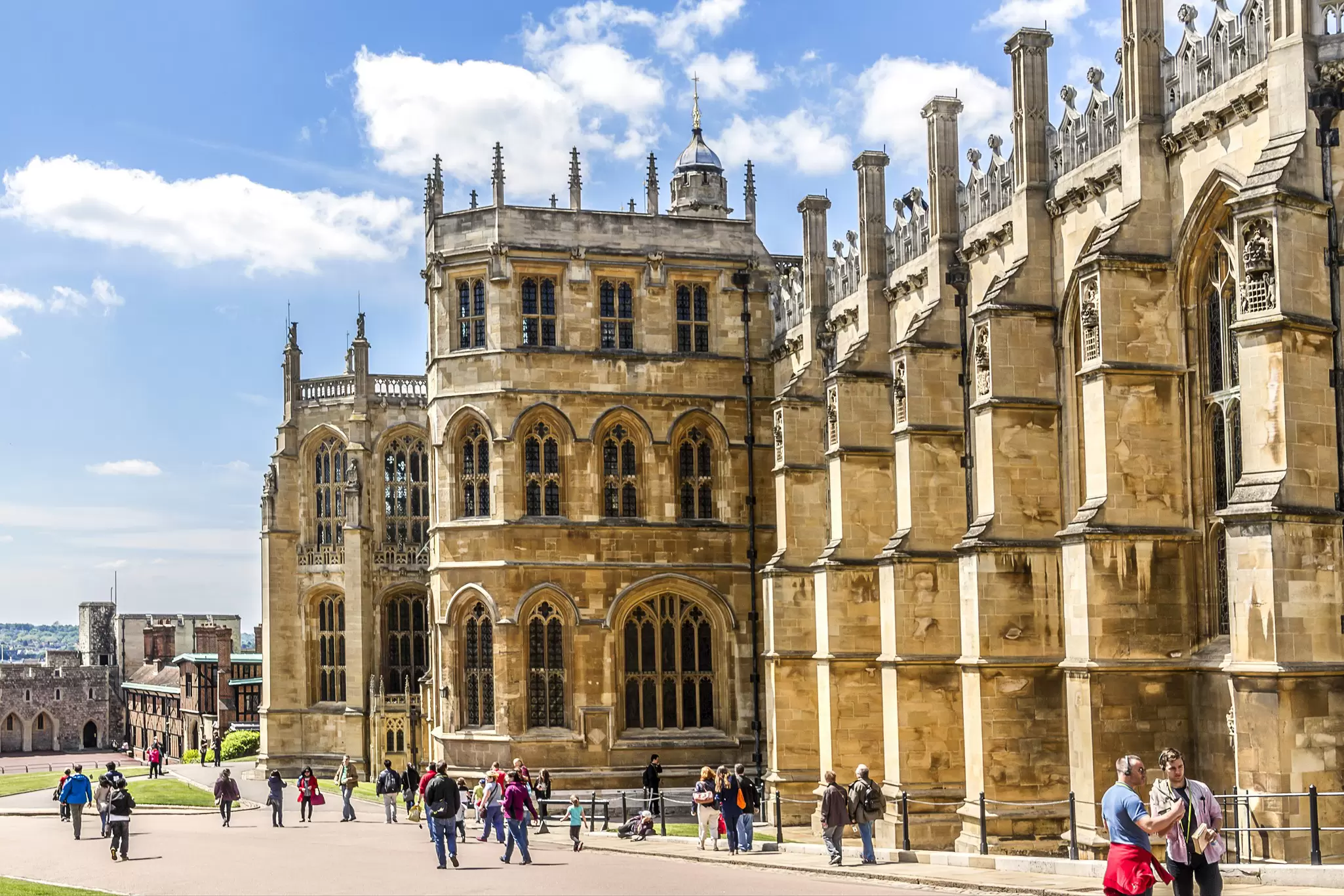 Exterior view of St. George's Chapel at Windsor Castle on a sunny day in the UK.