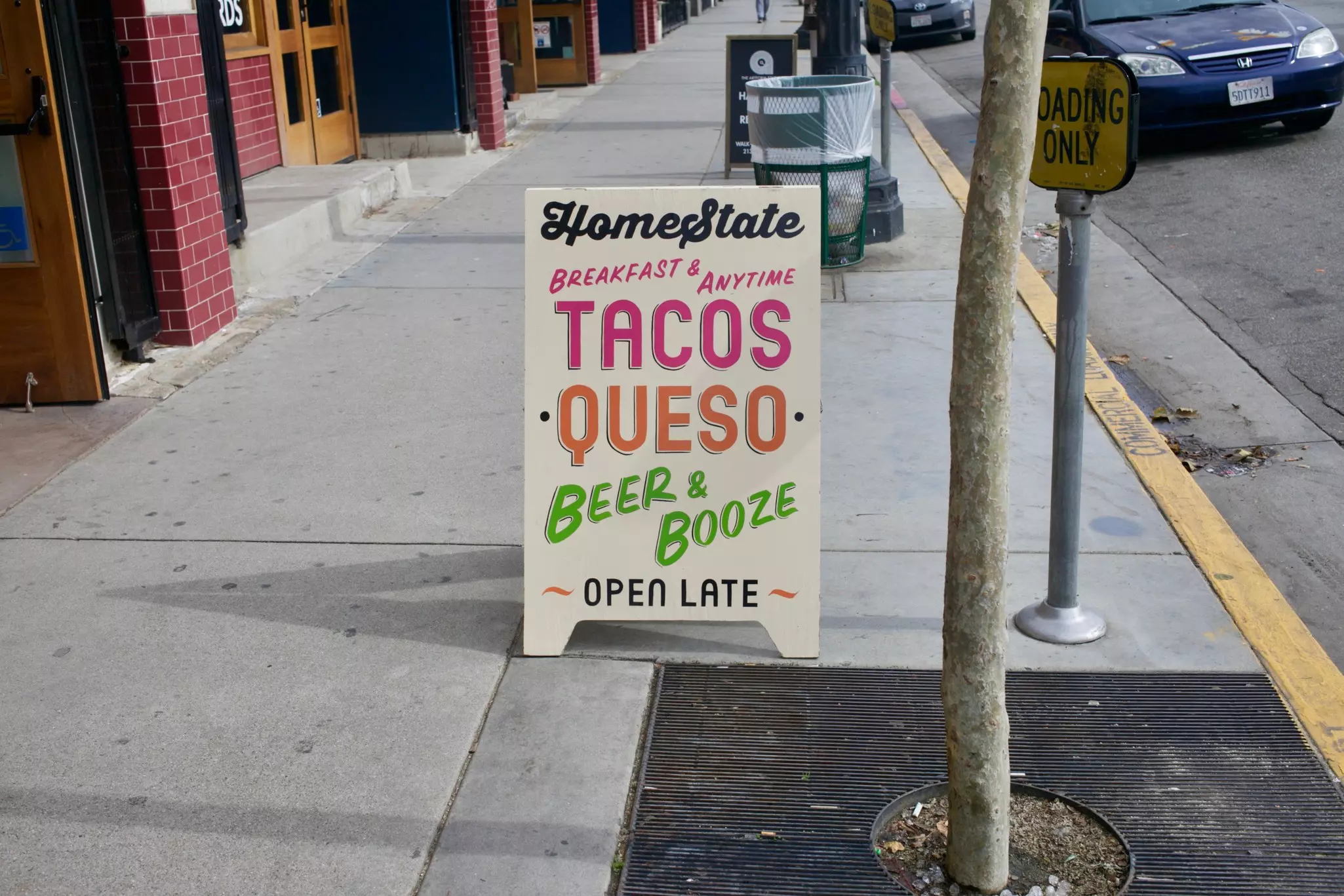A street sign for the Homestate taco restaurant in Los Angeles, California.