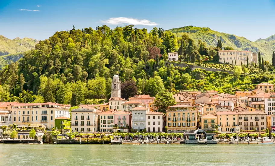 Bellagio on Lake Como: pastel waterfront hotels, a bell tower and wooded hill seen from the water