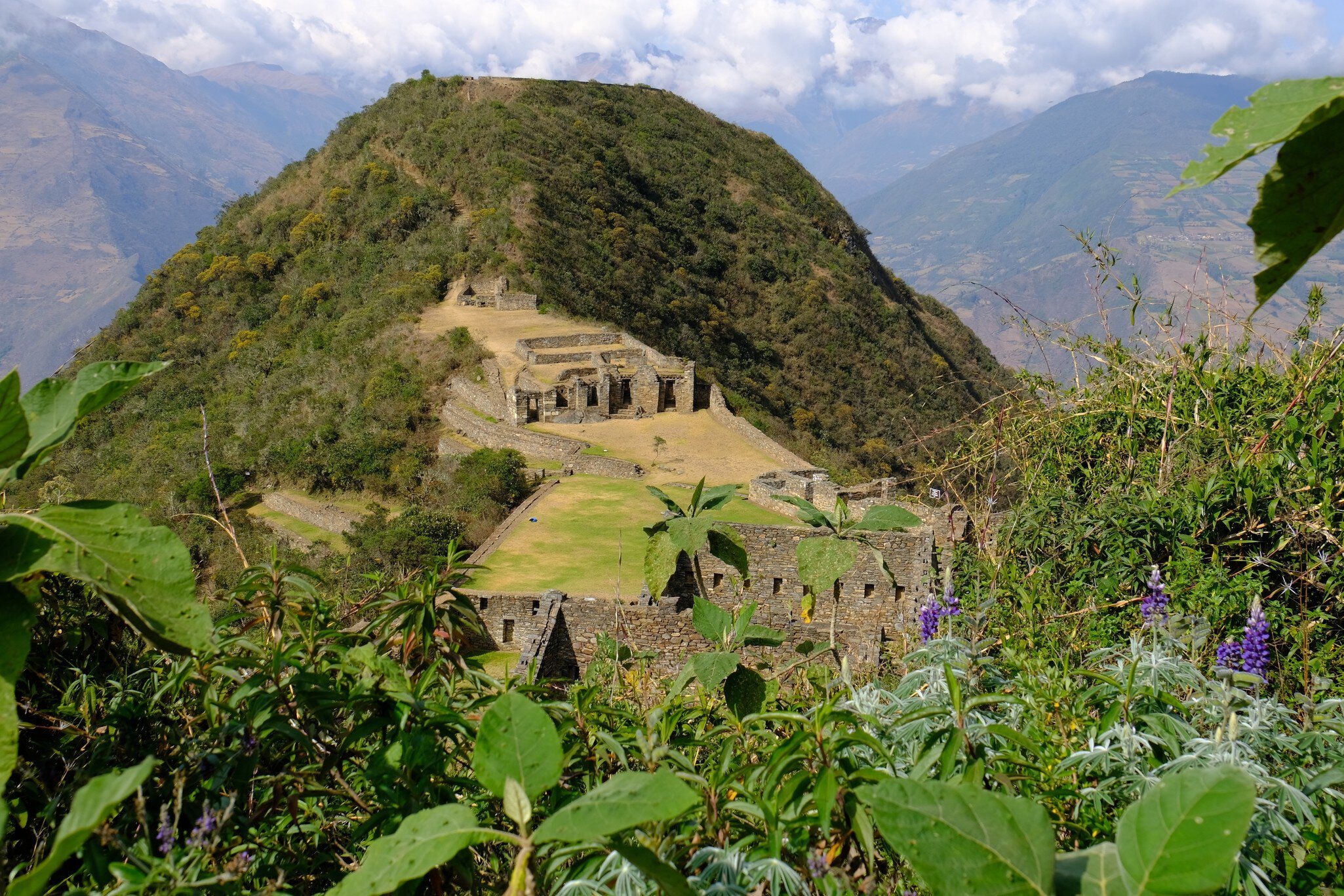 Panoramic view of Choquequirao, an Incan archaeological site in Peru, similar in structure and architecture to Machu Picchu.