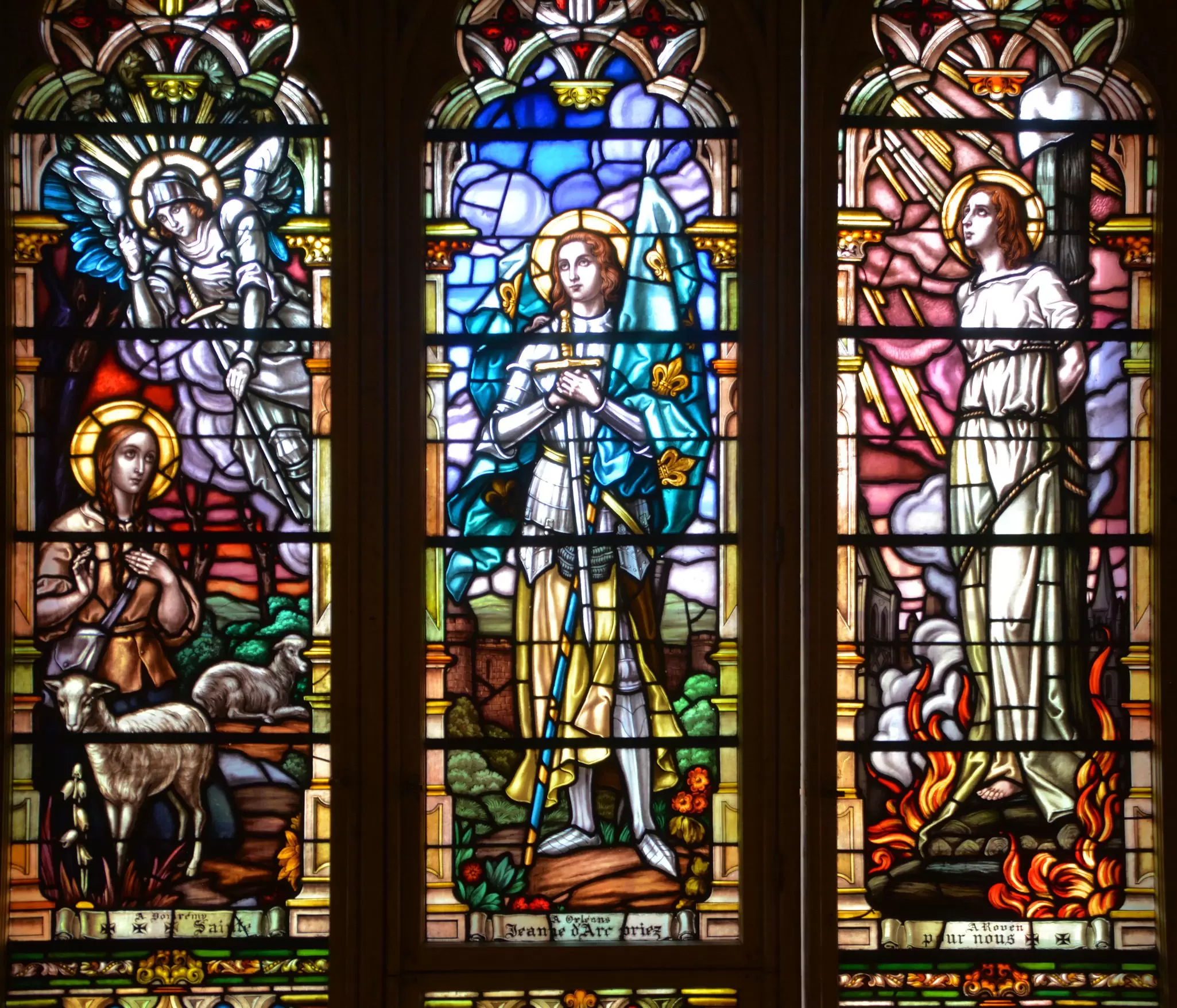 Stained glass windows showing saintly figures