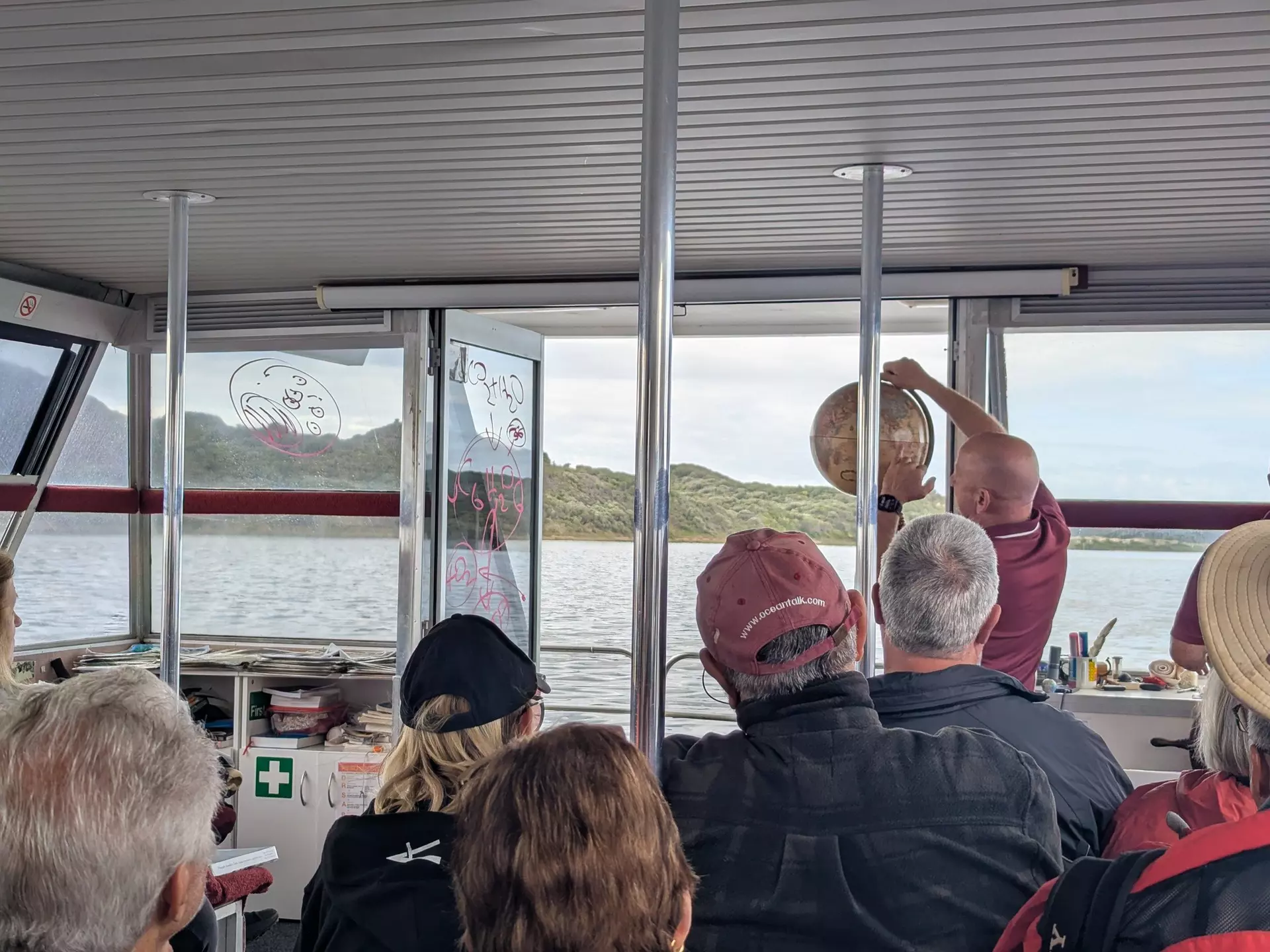WALPOLE, WESTERN AUSTRALIA, AUSTRALIA, OCTOBER 2025.
Tourists enjoying the WOW Wilderness EcoCruise tour, sitting on a boat with the tour guide speaking up front and the inlet in the background.
Assigning editor: Jessica Lockhart